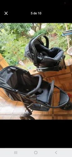 Carrinho e bebê conforto usado em estado de novo.