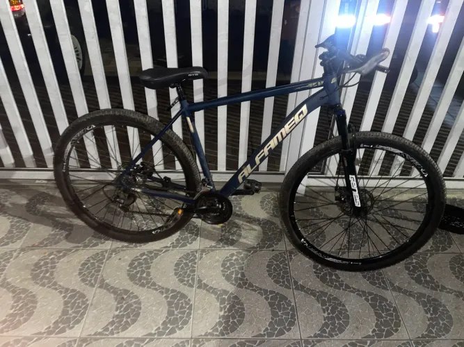 Bicicleta aro 29 alfamec, com cubo k7 e amortecedor de trava com notinha