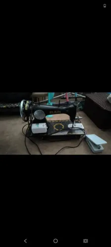 Máquina de costura eletrica