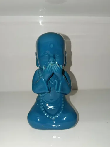 Buda de cerâmica decorativo