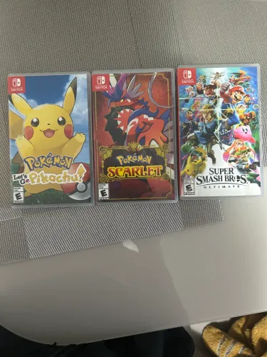 Jogos Nintendo Switch originais-pokemon scarlet e let's go pikachu, super smash bross.