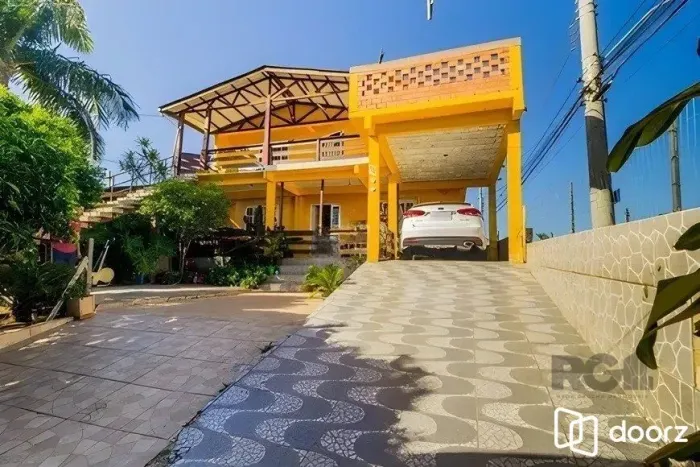 casa de 4 dormitórios, no bairro Lomba do Pinheiro