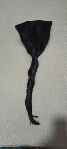 Cabelo humano na tela com tic tac