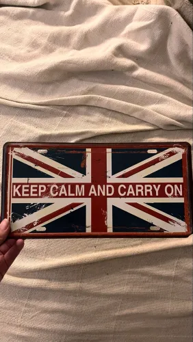 Placa decorativa de metal