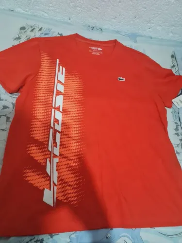 Camisa da lacoste original tamanho M que tambem serve no G, numero : *