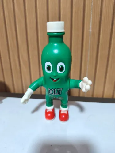 Boneco Dollynho em formato de garrafa antigo muito bem conservado raridade