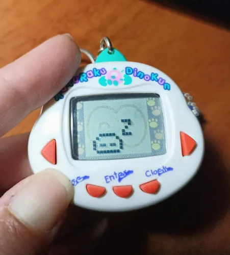 Tamagotchi Rakuraku Dinokun Branco