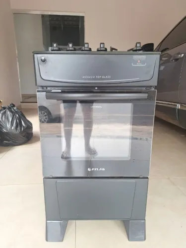 Fogão Atlas 4 bocas preto com tampo de vidro